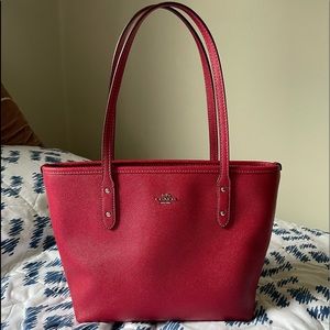 Fuchsia Coach tote. Used a few times and ready for a new home. No wear or tear.